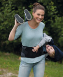 Lifestyle Image Woman with child wearing JuzoPro Lumbal Xtec Plus