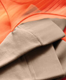 3. Lifestyle image Juzo Inspiration Juzo Inspiration tights lie on an orange tulle Dress