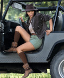 2. Lifestyle image Juzo Adventure Woman wears Juzo Adventure in cocoa and gets out of an off-road vehicle
