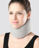 Woman wearing cervical collar support 