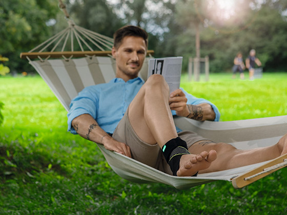 Man in a hammock wearing the JuzoPro Malleo Xtec Strong Man in a hammock wearing the JuzoPro Malleo Xtec Strong